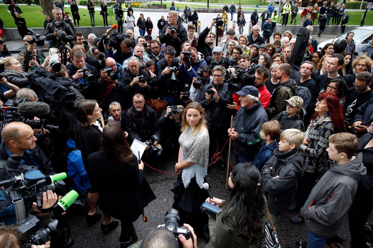 Outside the Shell building where she sang in protest against the company's drilling for oil