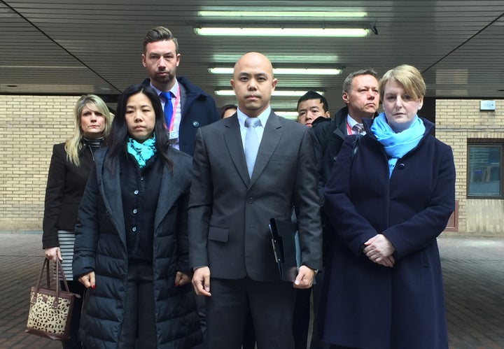 Stephanie Ho (front left) and Derek Ho (centre), sister and brother of beheading victim Samantha Ho, with Detective Constable Nigel Ebdale (back left) and other members of their family outside Southwark Crown Court after the sentencing