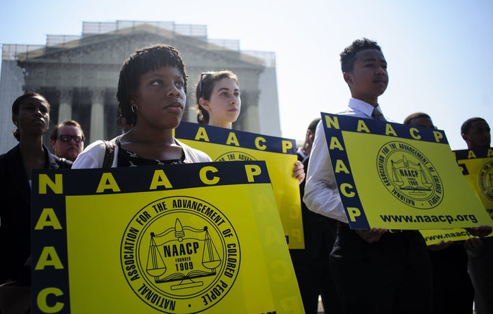 Jessica Pickens, 19, stands with fellow voting rights activists outside the U.S. Supreme Court in Washington, D.C., on June 25, 2013, the day the court ruled on the Voting Rights Act striking down portions of the law.