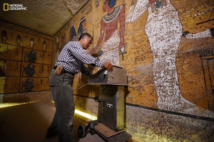 Radar specialist Hirokatsu Watanabe examines the walls of King Tut's tomb in an image provided by National Geographic.