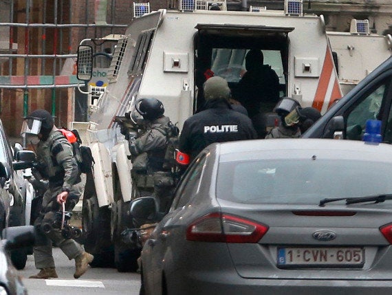 Armed police during the raid