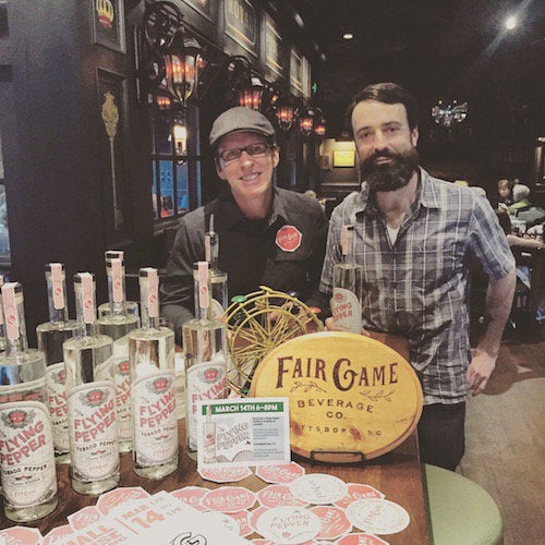 Kevin Bobal, left, and Chris Jude of Fair Game Beverage Co. in Pittsboro, North Carolina introduce Flying Pepper vodka at The Marshall Free House in Greensboro.