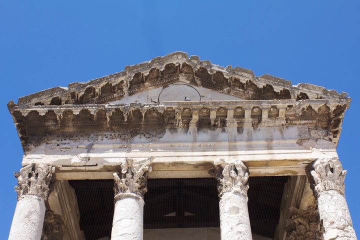 The fascade of the Temple of Augustus as it appears today.