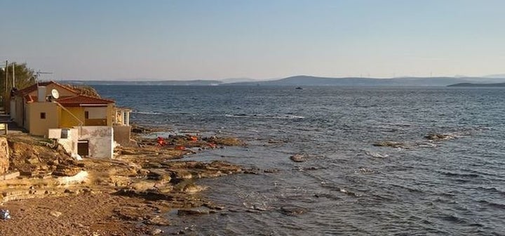 Life jackets of recently arrived refugees are seen on the shores of Lesbos Island, Greece.