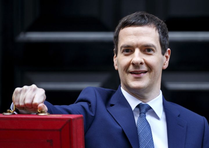 George Osborne posing for photographers outside 11 Downing Street in London, England before presenting his annual budget to Parliament on March 16, 2016