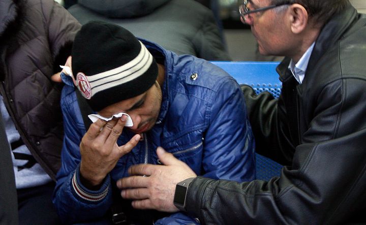 Relatives of the victims of the airplane crash mourn at the airport in Rostov-on-Don