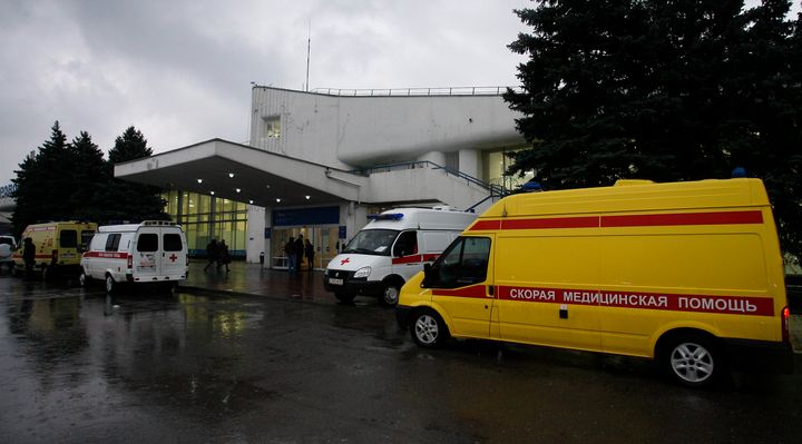 Ambulances are seen outside the airport entrance following the crash