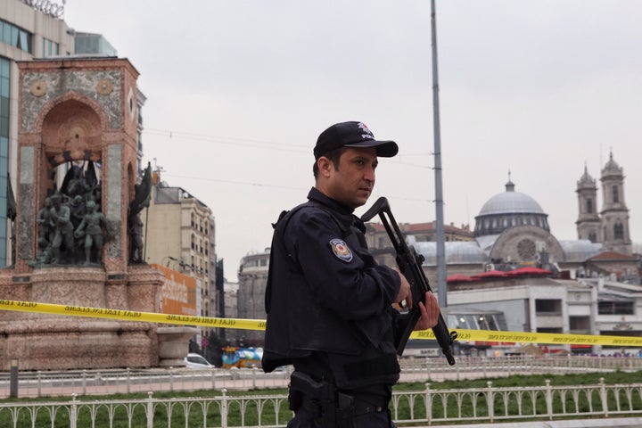 It was the fourth suicide attack in Turkey already this year. Pictured, a police officer guards Taksim square after Saturday's bombing.