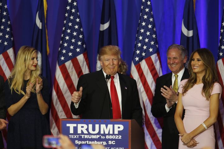 Donald Trump, flanked by his daughter Ivanka (L) and wife Melania (R). Trump said on Saturday that they tell him to "act presidential."