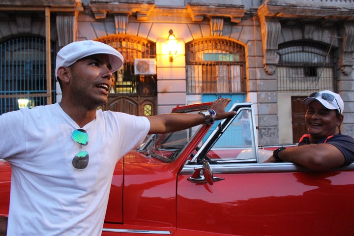 José Valderrama (left) and Ramón Martínez (right) drive refurbished taxis for international tourists. Th
