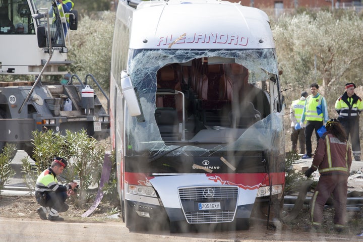 Fire fighters are seen at the scene of the accident