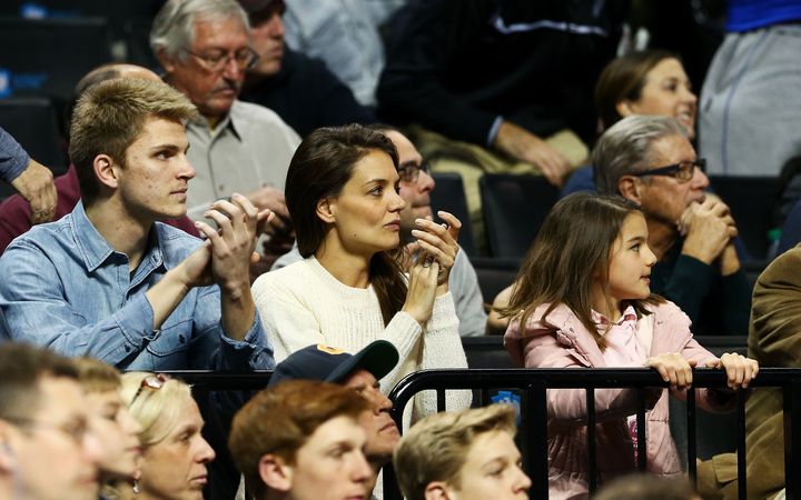 Actress Katie Homes and her daughter Suri Cruise attend the game between the Stephen F. Austin Lumberjacks and the Notre Dame Fighting Irish during the second round of the 2016 NCAA Men's Basketball Tournament at Barclays Center on March 20, 2016.