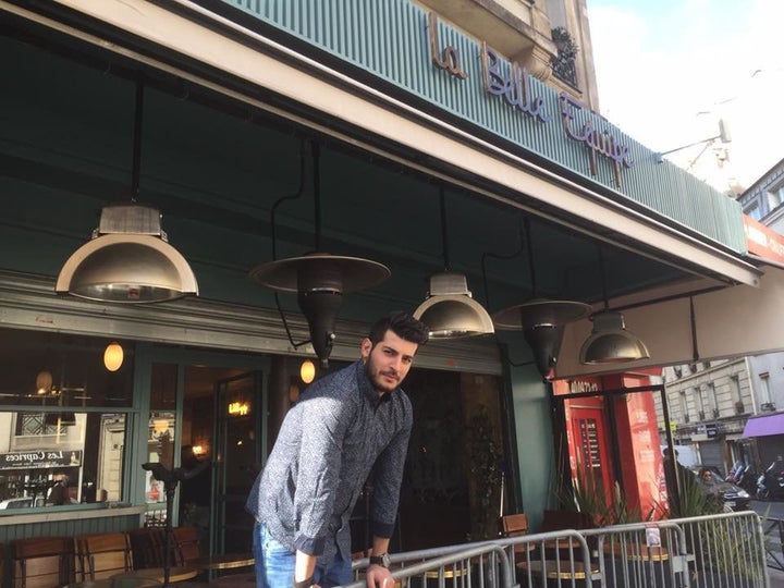 A waiter at La Belle Equipe awaits customers Monday afternoon.