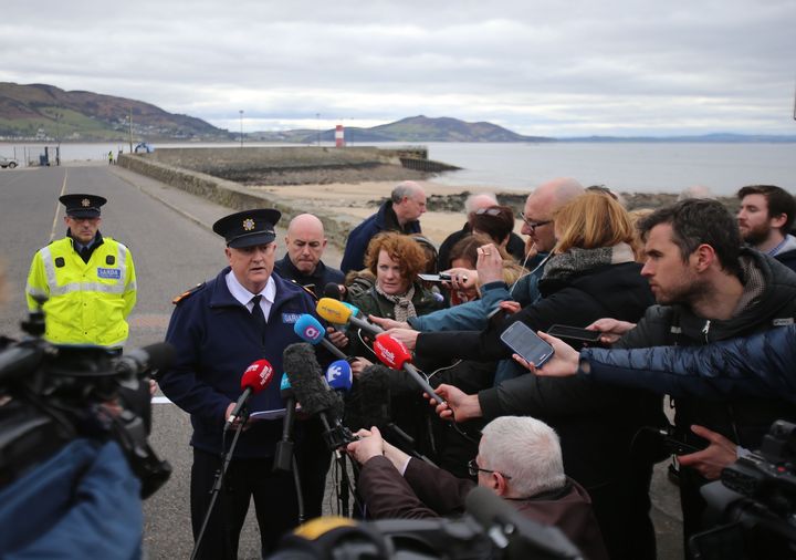 Police speak at the scene of the tragedy at Buncrana Pier 