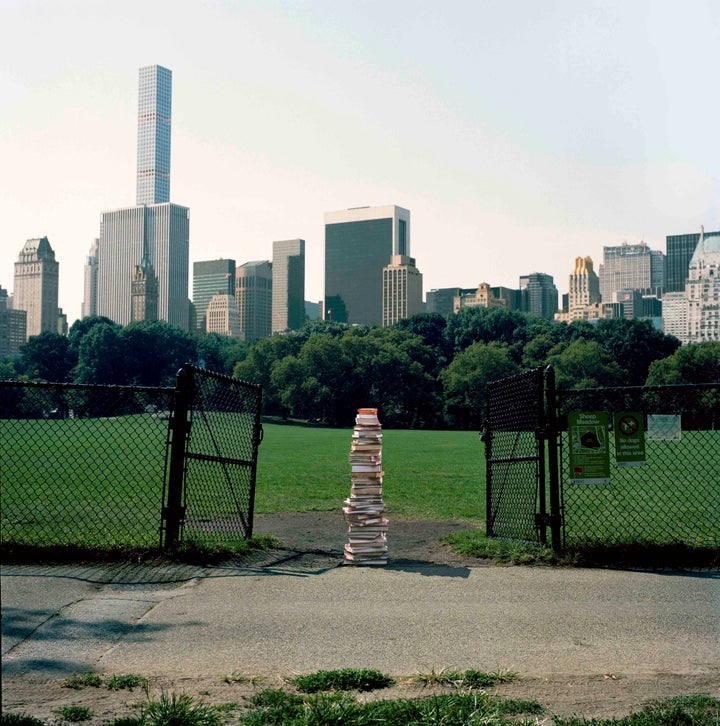 Stack of books left in Central Park.