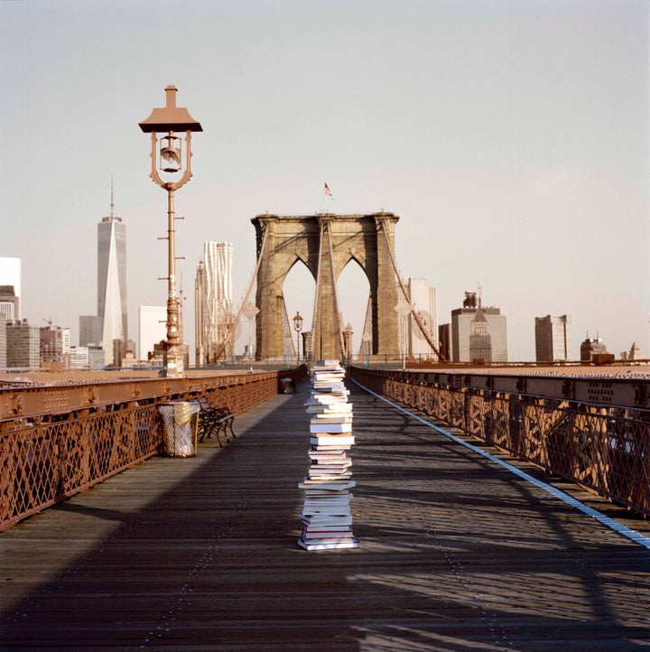 Stack of books left on the Brooklyn Bridge.