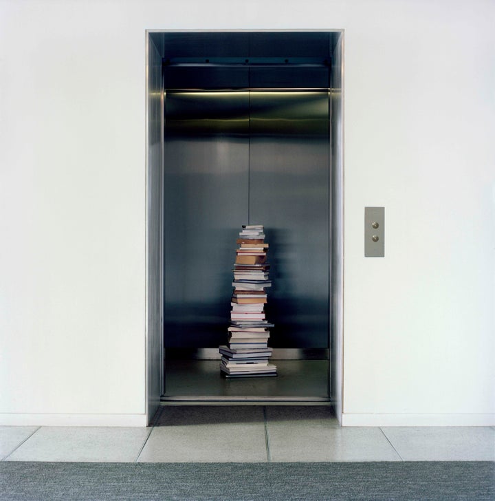 Stack of books left in a building’s elevator in the Upper West Side.