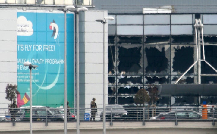 Military guard the area as passengers are evacuated from Zaventem Bruxelles International Airport after a terrorist attack Tuesday in Brussels.