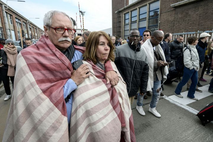Attacks in the Belgian capital of Brussels left at least 34 people dead on Tuesday. Here, people are evacuated from one of the sites of the attacks, the airport in Zaventem.