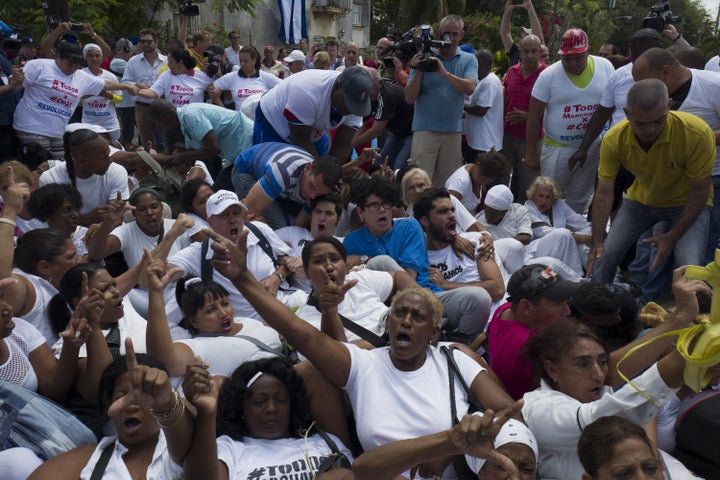 Members of the Ladies in White demonstrate hours before Obama began his visit to Havana. The Cuban government detained some 50 activists who had joined the peaceful weekly protest.