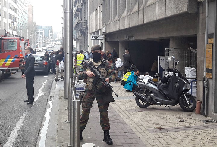 A Belgian soldier stands guard outside the Maelbeek metro station in Brussels on March 22, 2016. A series of apparently coordinated explosions ripped through the city on Tuesday.