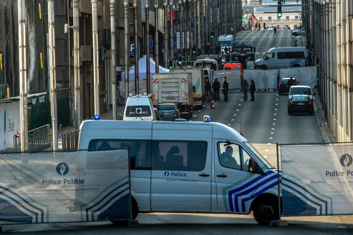 Police block access to the Maelbeek metro station in Brussels after explosions in the city.