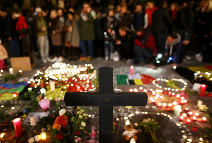 People light candles at the Place de la Bourse following today's attacks on March 22, 2016 in Brussels, Belgium