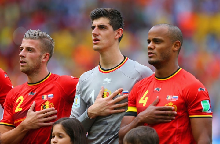 Members of the Belgium team sing their national anthem prior to a World Cup match against Russia on June