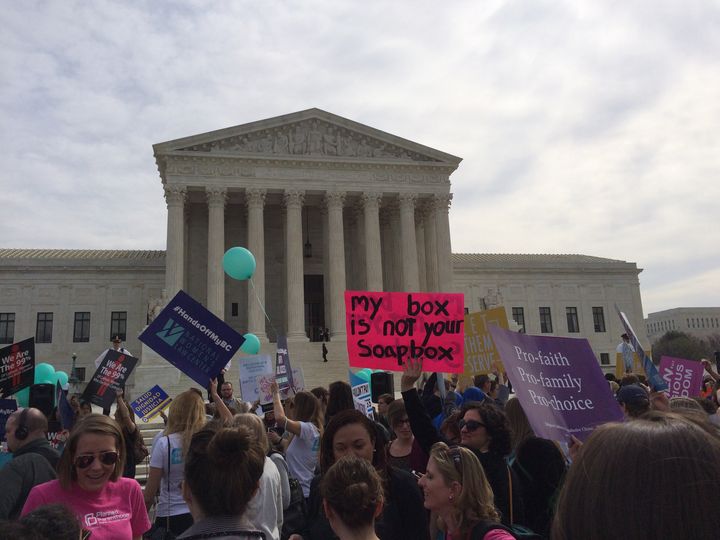 Protesters gather outside the Supreme Court Wednesday, March 23, 2016.