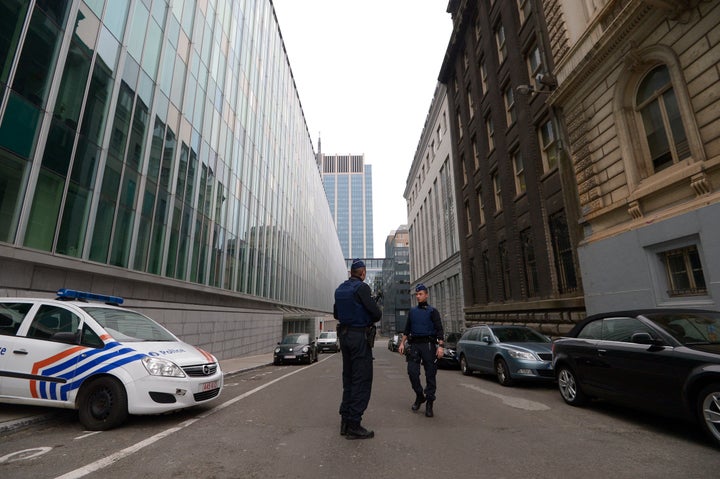 A picture taken in Brussels on March 19, 2016, shows the Belgian police officers standing outside the Belgian Federal Police
