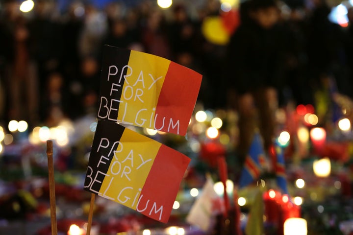 People gather at a makeshift memorial on the Place de la Bourse in Brussels on Wednesday. The use of TATP explosives by militants is not new, but they could indicate a degree of sophistication in ISIS's operations in Europe.