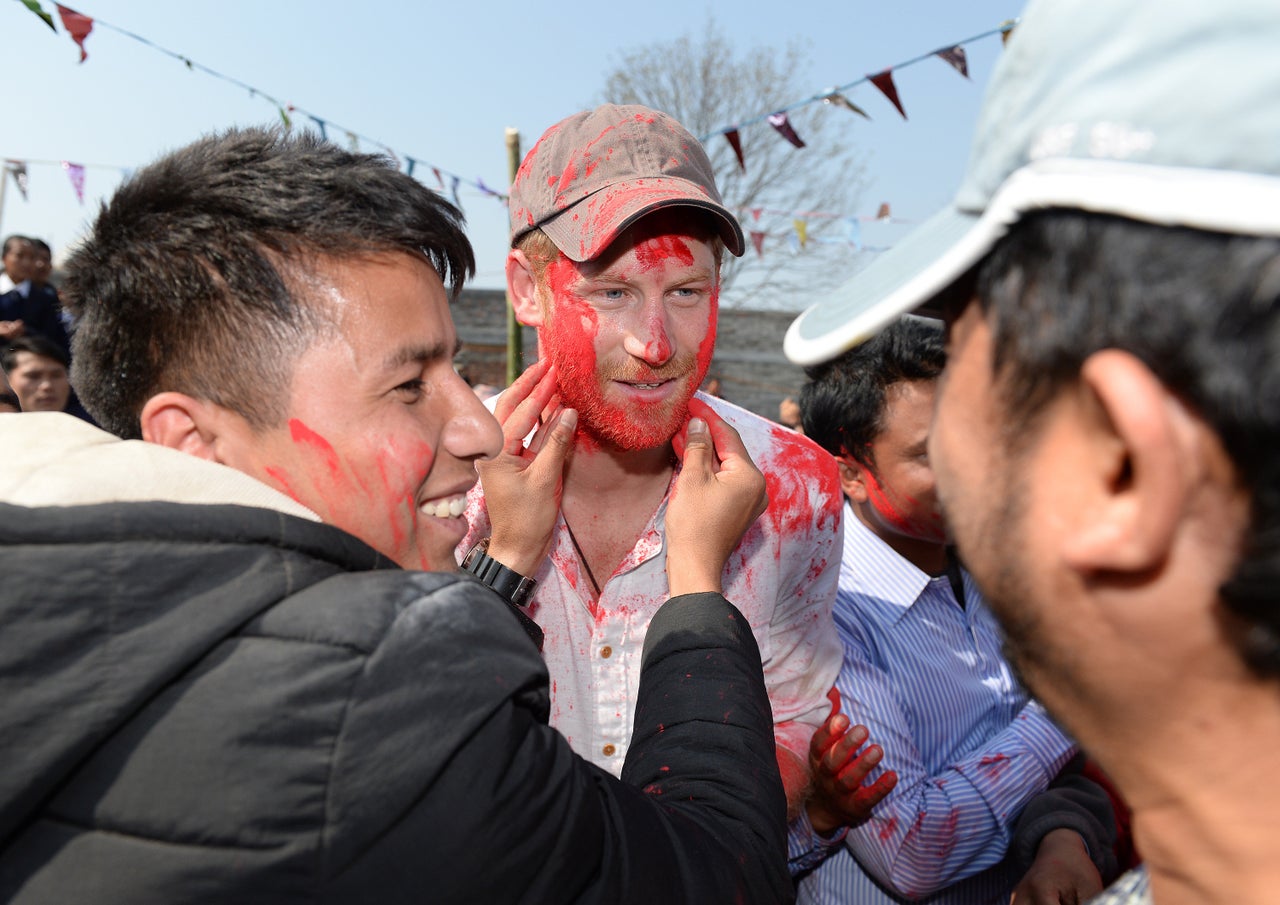 Prince Harry takes part in a holi celebration at Gauda Secondary School on day four of his visit to Nepal.