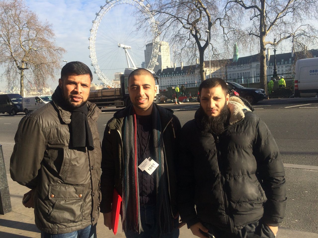 Amad (middle) with two friends after meeting the Justice Select Committee at the House of Commons for the Maslaha report