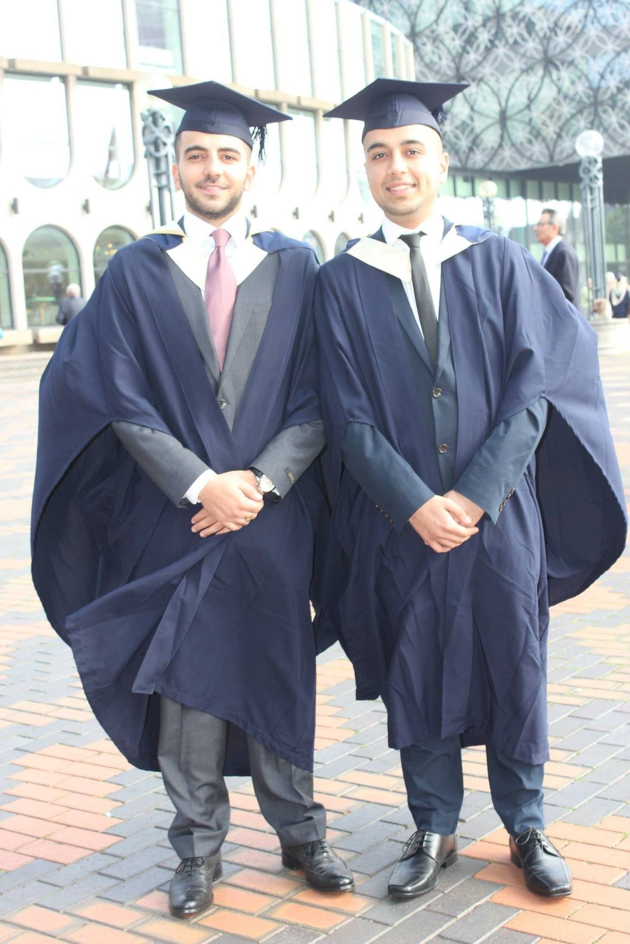 Amad (right) has graduated from a degree in criminology at Birmingham University since leaving prison