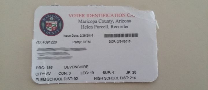 Maricopa County sent Jennifer Robbins a voter registration card that listed her party as "DEM," for "Democratic." Some information has been blurred out to preserve her privacy.