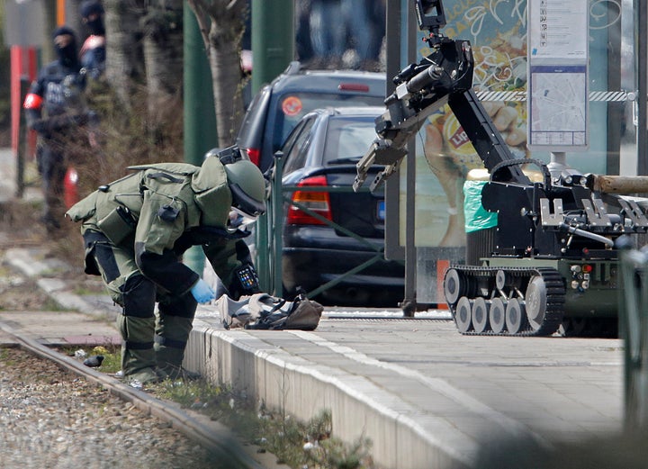 Police use a robotic device as they take part in a search in the Brussels borough of Schaerbeek following Tuesday's bombings in Brussels, Belgium, March 25, 2016