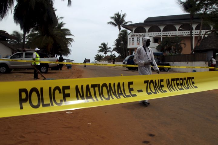 Ivorian police prepare to inspect the area of the hotel Etoile du Sud following an attack by gunmen at Grand Bassam, Ivory Coast