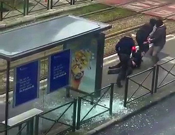 Belgian police were seen dragging a suspect along a tramway platform in Schaerbeek. 