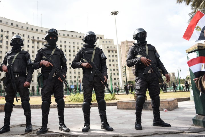 Members of the Egyptian police special forces stand guard on Cairo's landmark Tahrir Square on Jan. 25, the fifth annive