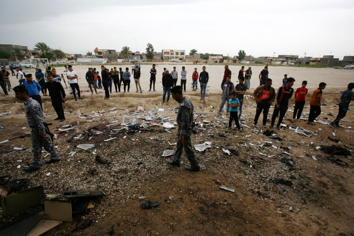 The scene after the blast in Iskandariya, a mixed Sunni and Shi'ite Muslim town south of Baghdad.