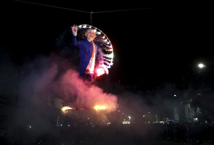 This effigy of the billionaire businessman went up in flames in Mexico City's La Merced neighborhood on Saturday.