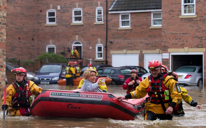 A woman being rescued in floods in York in December 2015