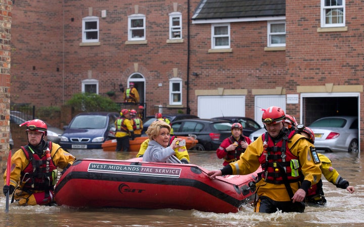 A woman being rescued in floods in York in December 2015