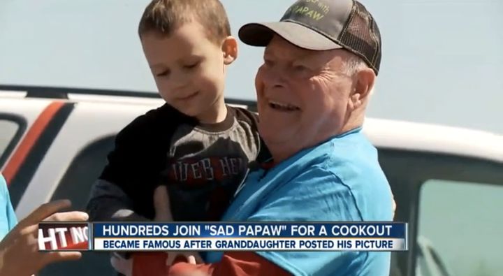 Kenneth Harmon, more famously known as "Sad Papaw," poses for photos during a cookout on Saturday.