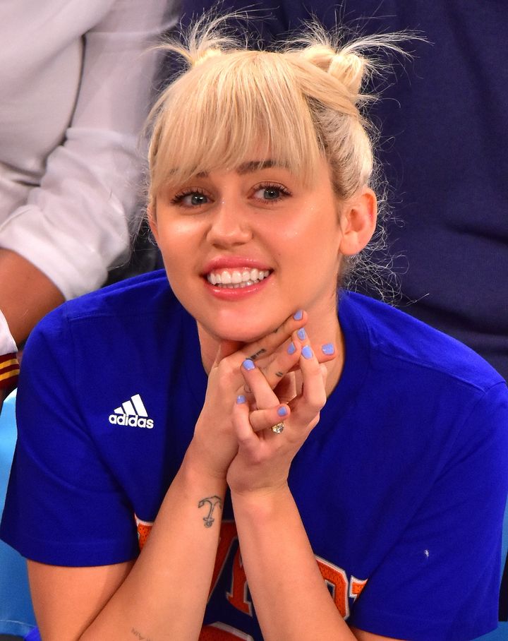Miley Cyrus attends the Cleveland Cavaliers vs New York Knicks game at Madison Square Garden on March 26, 2016 in New York City.