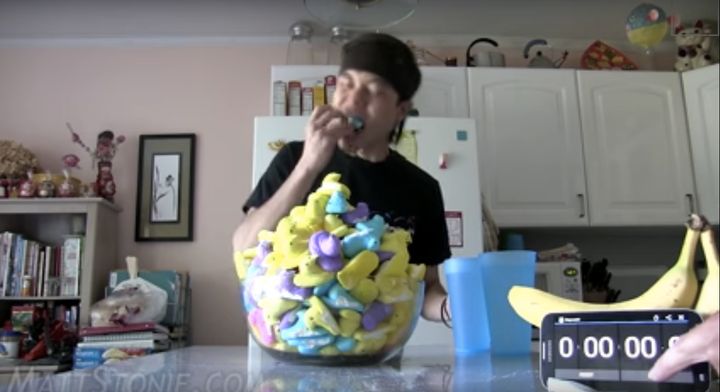 Competitive eater Matt "Megatoad" Stonie is seen sinking his teeth into the first of 200 marshmallow Peeps.