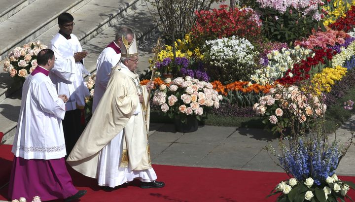 Pope Francis is seen arriving to lead Easter Mass which was held under tight security.