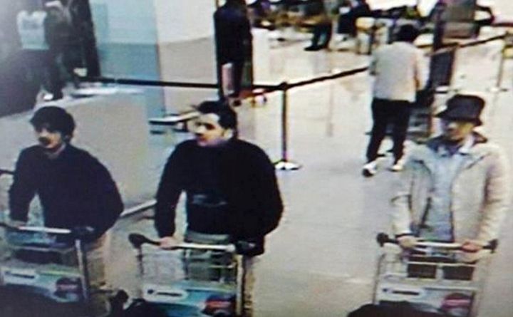 A CCTV still of the airport attackers including the 'man in white' (right), who is believed to have survived and remain at large
