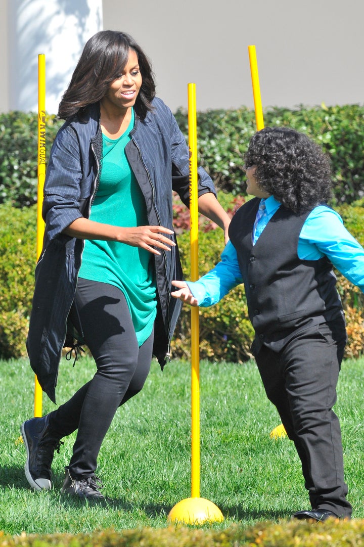 Michelle Obama searches for eggs at the White House Easter Egg Roll on Monday.