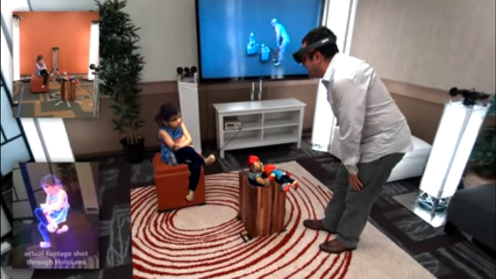 A Microsoft employee is seen viewing a 3D version of his daughter in real-time thanks to holoportation. The box on the bottom left shows what he sees, while the child's actual physical location is seen in the top left box.